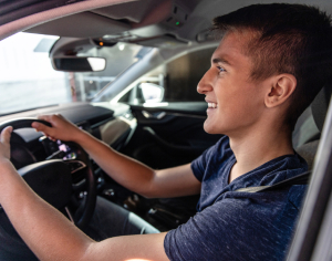 A boy behind the wheel